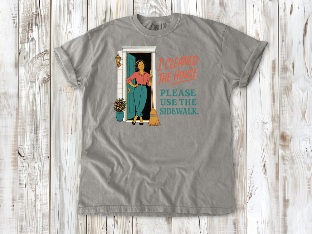 Khaki garment-dyed tee with I Cleaned the House Please Use the Sidewalk cleaning graphic.
