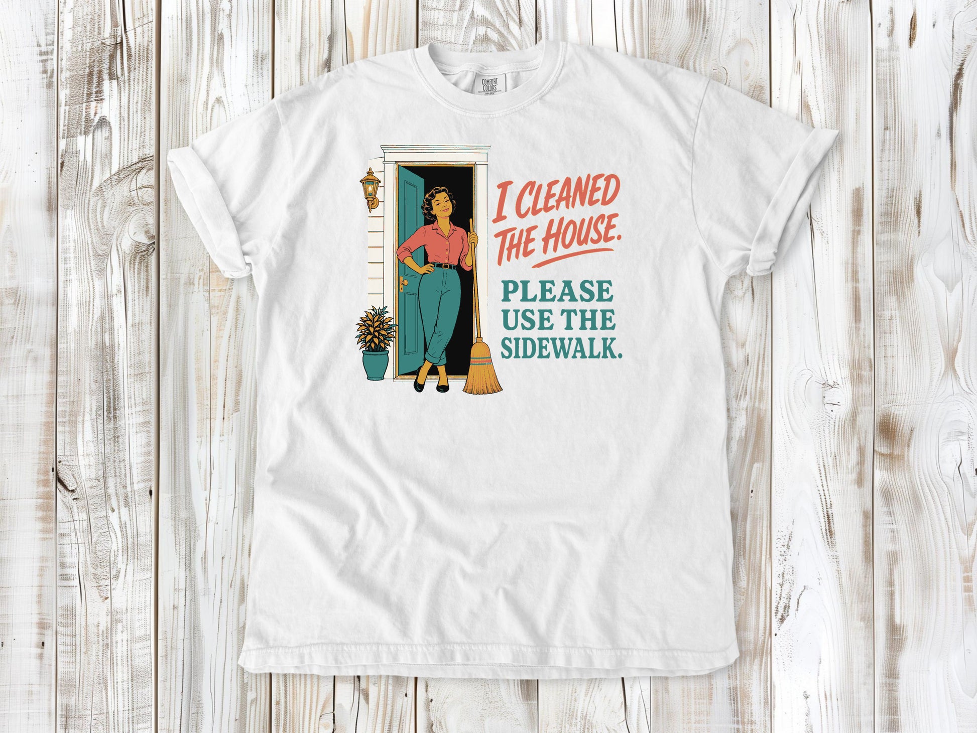 White garment-dyed tee with I Cleaned the House Please Use the Sidewalk cleaning graphic.