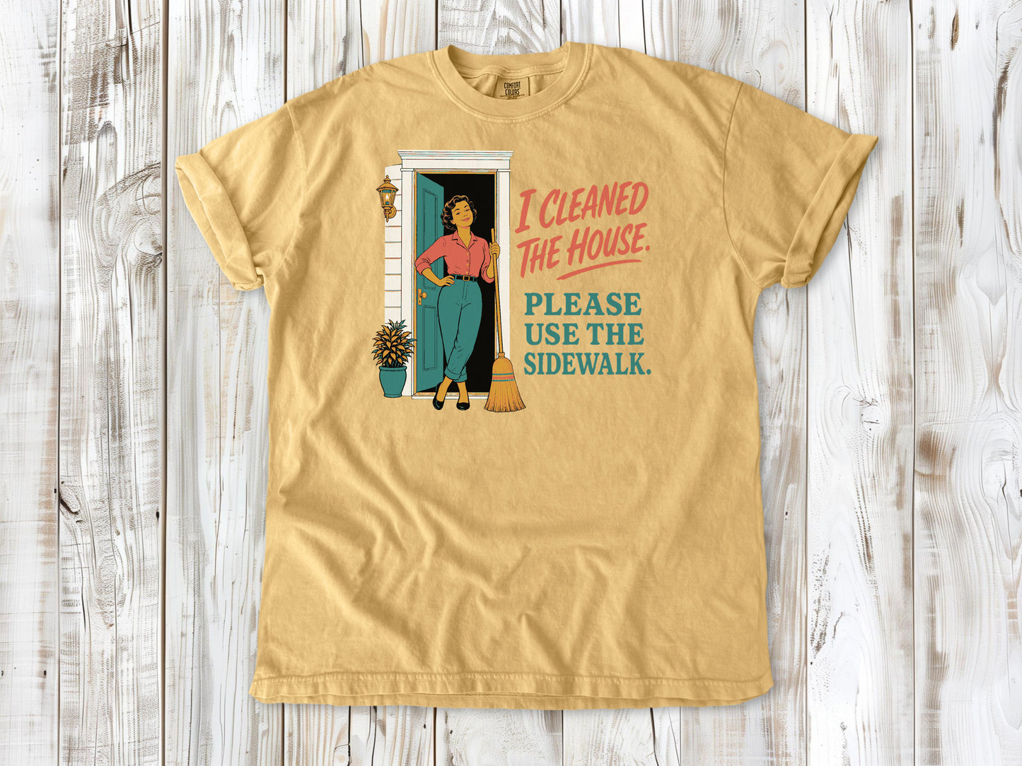 Burnt Orange garment-dyed tee with I Cleaned the House Please Use the Sidewalk cleaning graphic.