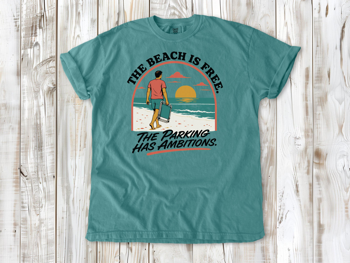 Mustard garment-dyed tee with The Beach Is Free The Parking Has Ambitions coastal graphic.