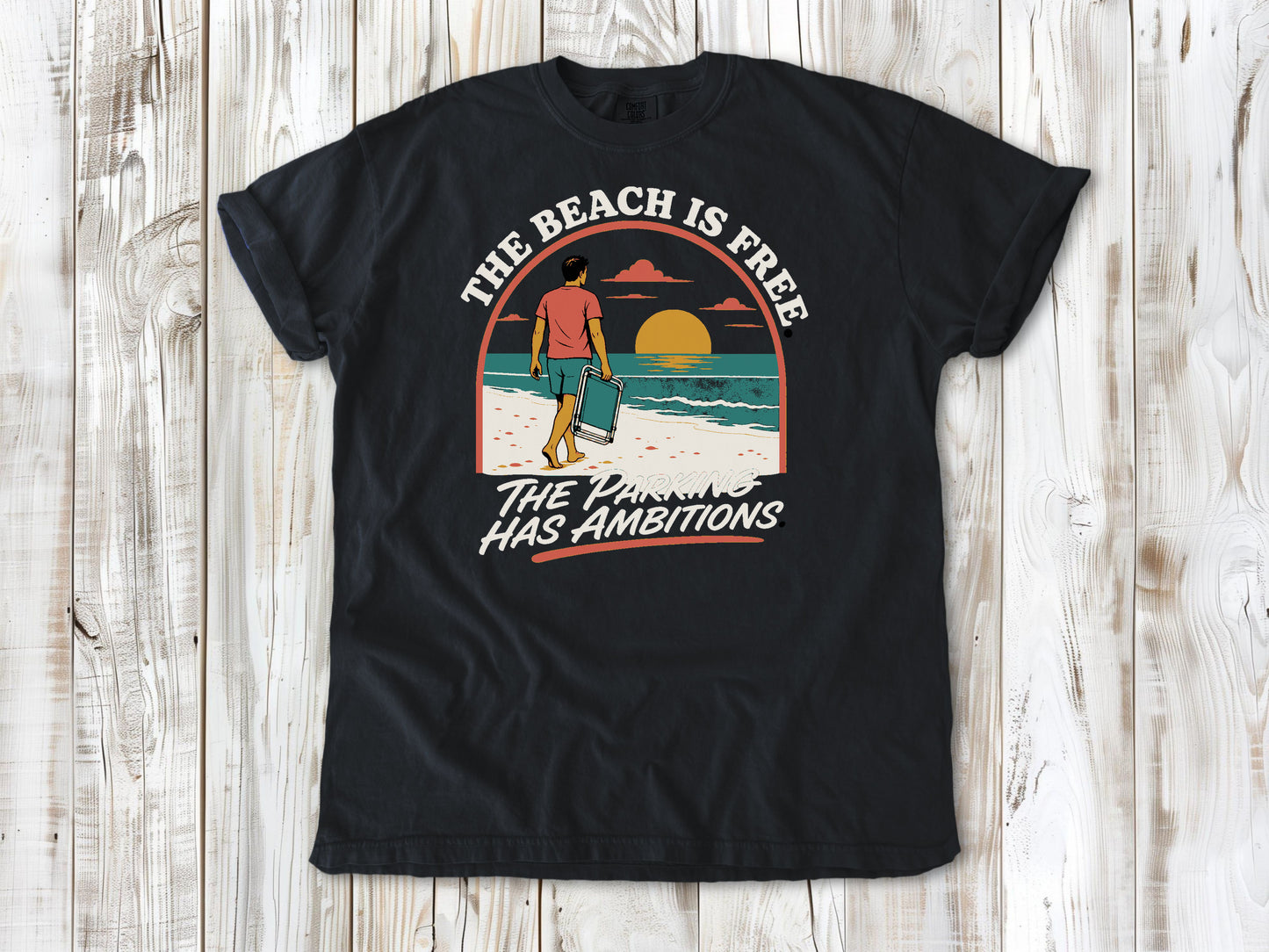 Washed Denim garment-dyed tee with The Beach Is Free The Parking Has Ambitions coastal graphic.