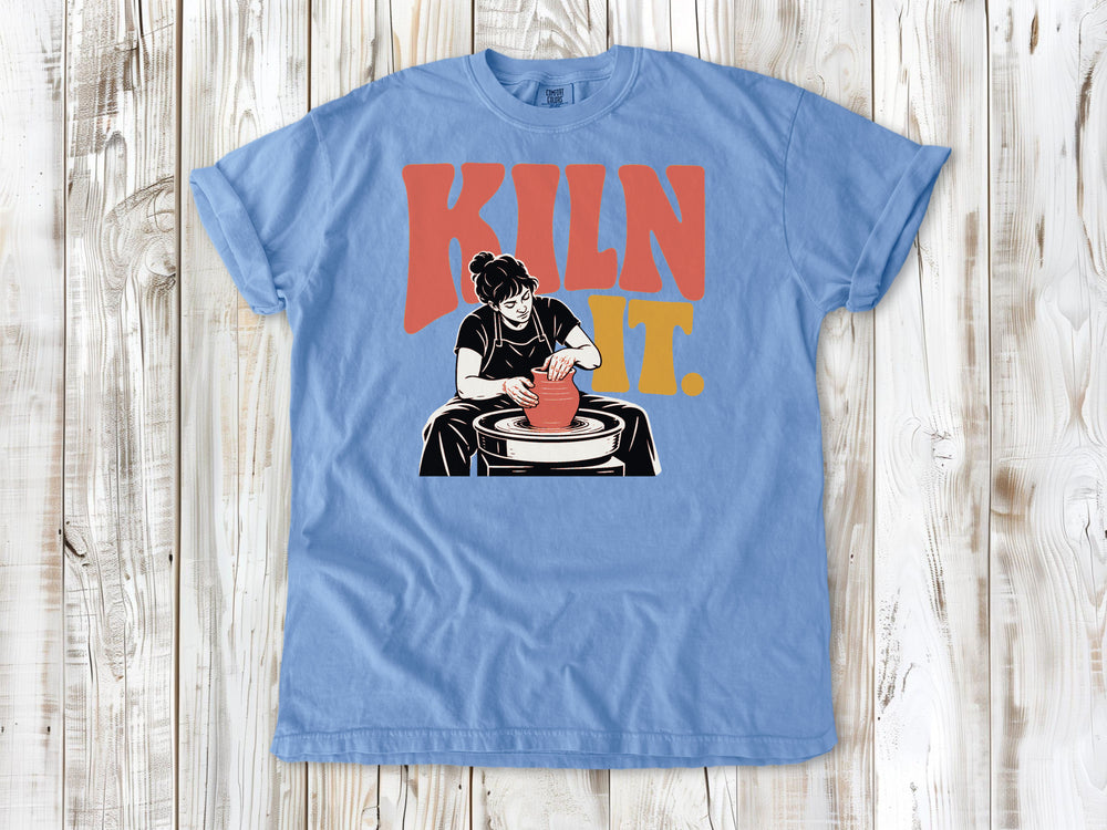 Pepper garment-dyed tee with Kiln It pottery graphic.