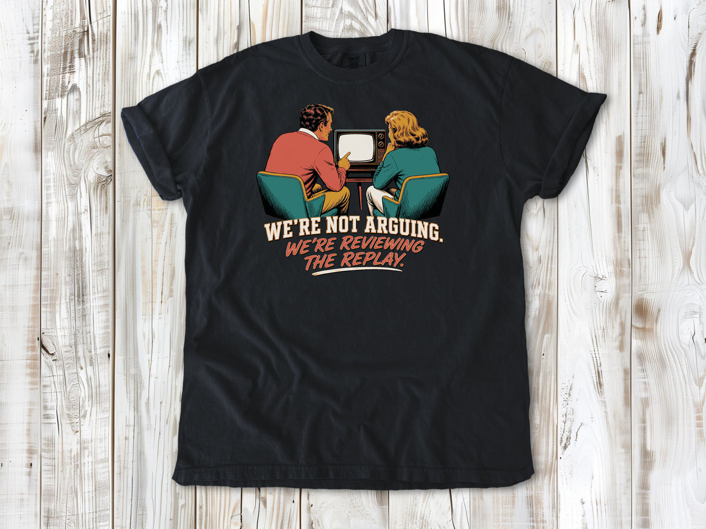 Washed Denim garment-dyed tee with We're Not Arguing We're Reviewing the Replay game day graphic.