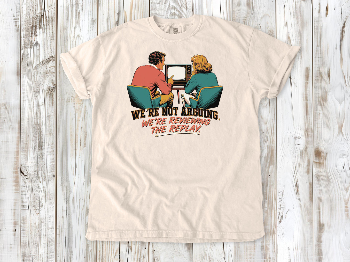 Butter garment-dyed tee with We're Not Arguing We're Reviewing the Replay game day graphic.