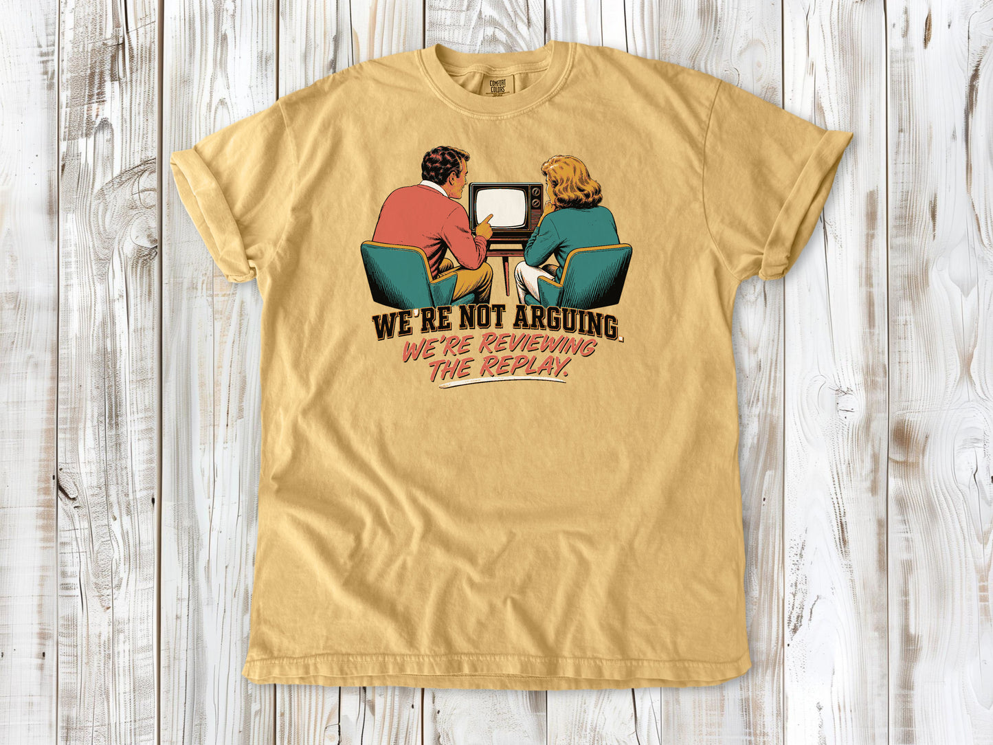 Burnt Orange garment-dyed tee with We're Not Arguing We're Reviewing the Replay game day graphic.