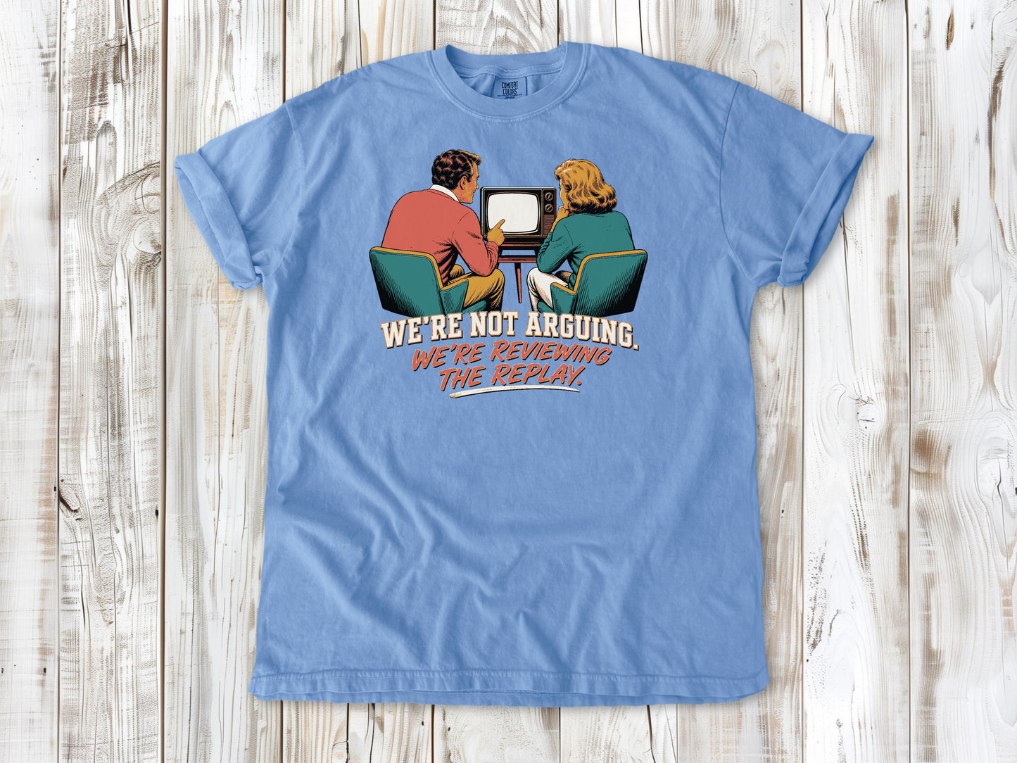 Pepper garment-dyed tee with We're Not Arguing We're Reviewing the Replay game day graphic.