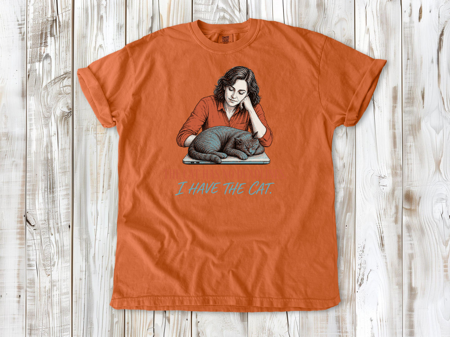 Seafoam garment-dyed tee with The Cat Has No Deadlines I Have the Cat remote work graphic.