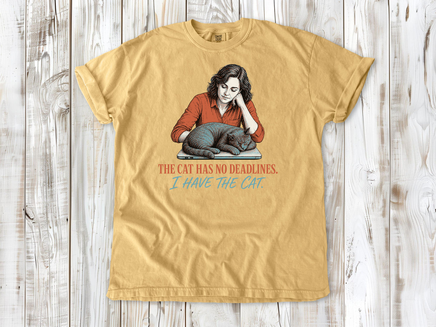 Burnt Orange garment-dyed tee with The Cat Has No Deadlines I Have the Cat remote work graphic.