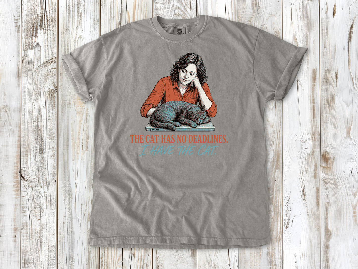 Khaki garment-dyed tee with The Cat Has No Deadlines I Have the Cat remote work graphic.