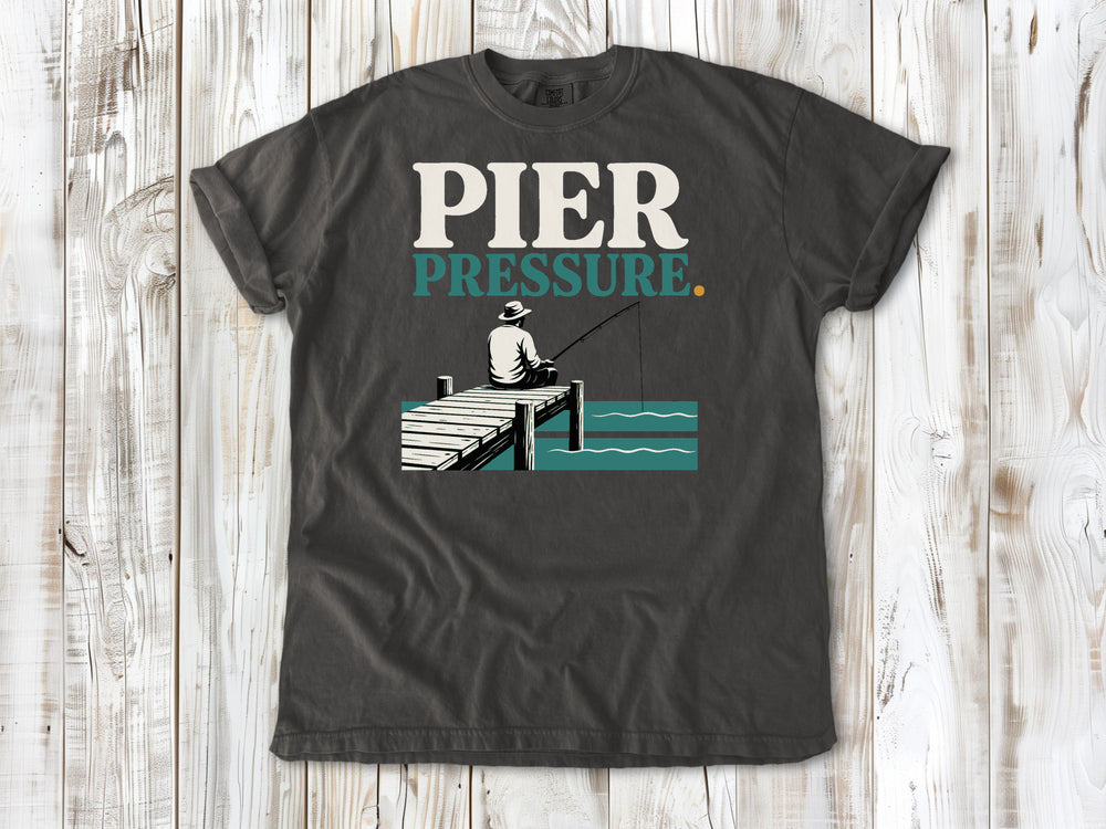 Ivory garment-dyed tee with Pier Pressure fishing graphic.
