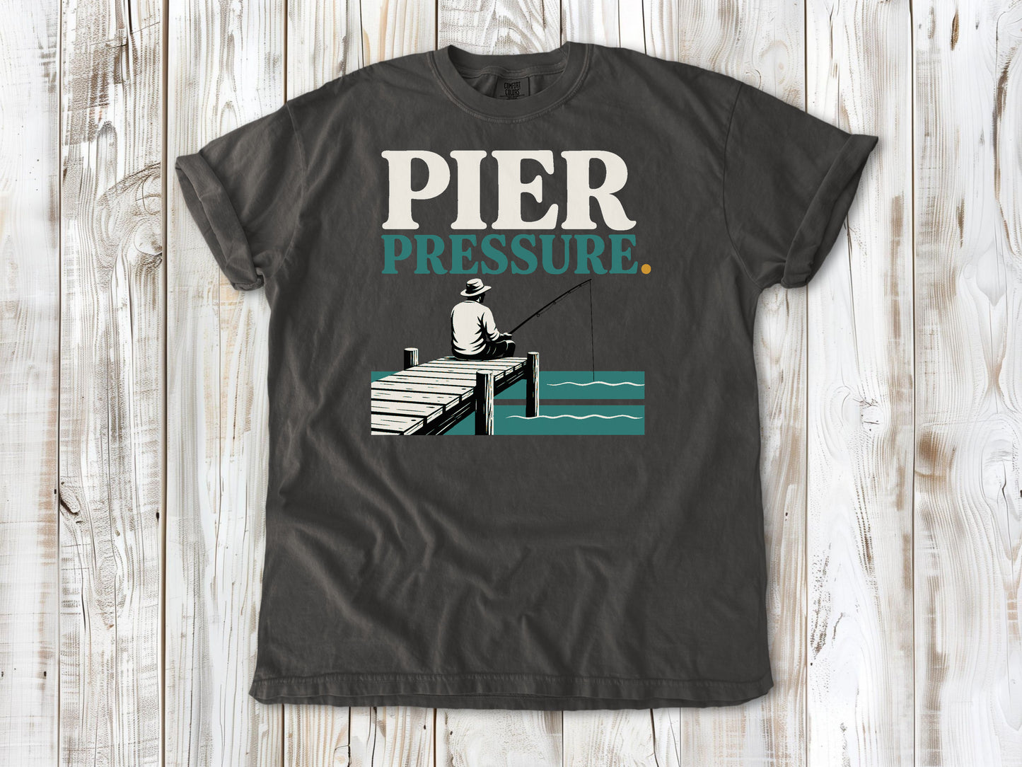 Ivory garment-dyed tee with Pier Pressure fishing graphic.