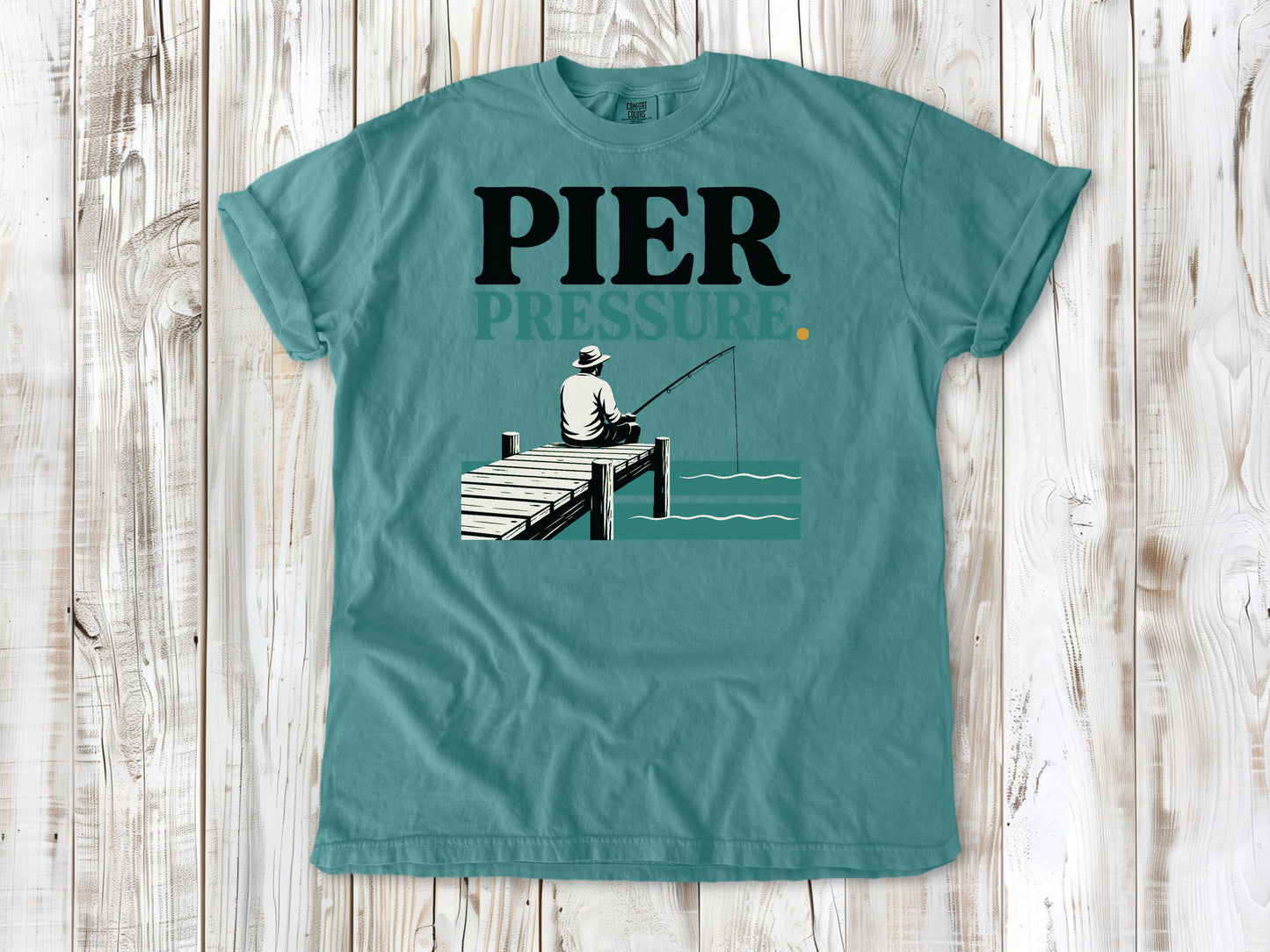 Mustard garment-dyed tee with Pier Pressure fishing graphic.