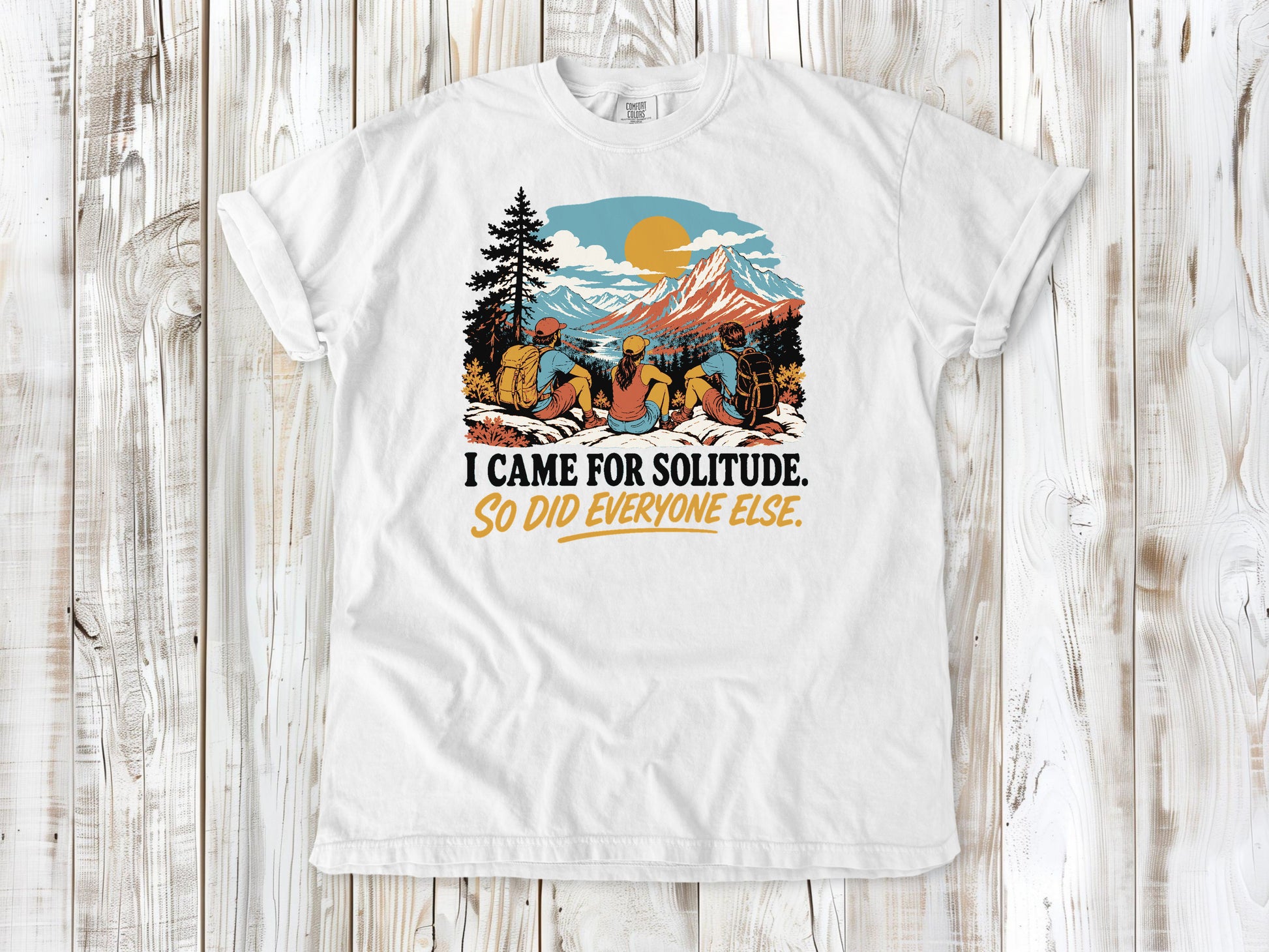 White garment-dyed tee with I Came for Solitude So Did Everyone Else hiking graphic.