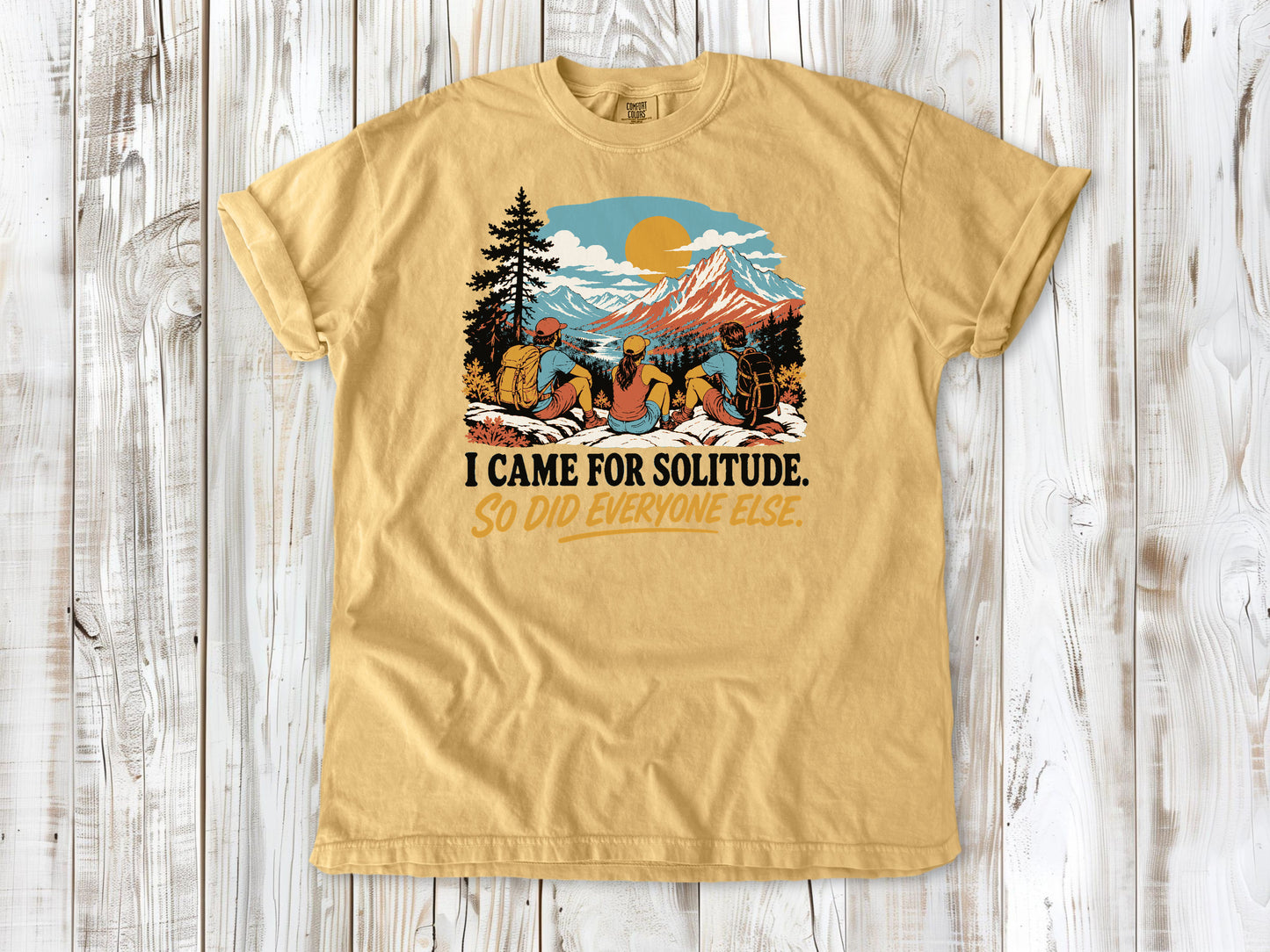 Burnt Orange garment-dyed tee with I Came for Solitude So Did Everyone Else hiking graphic.