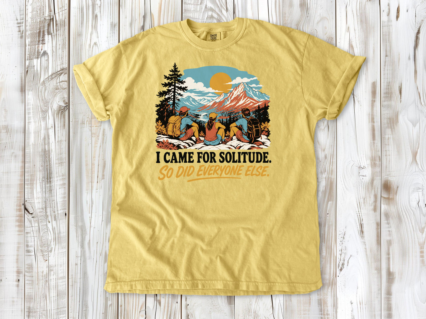 Grey garment-dyed tee with I Came for Solitude So Did Everyone Else hiking graphic.