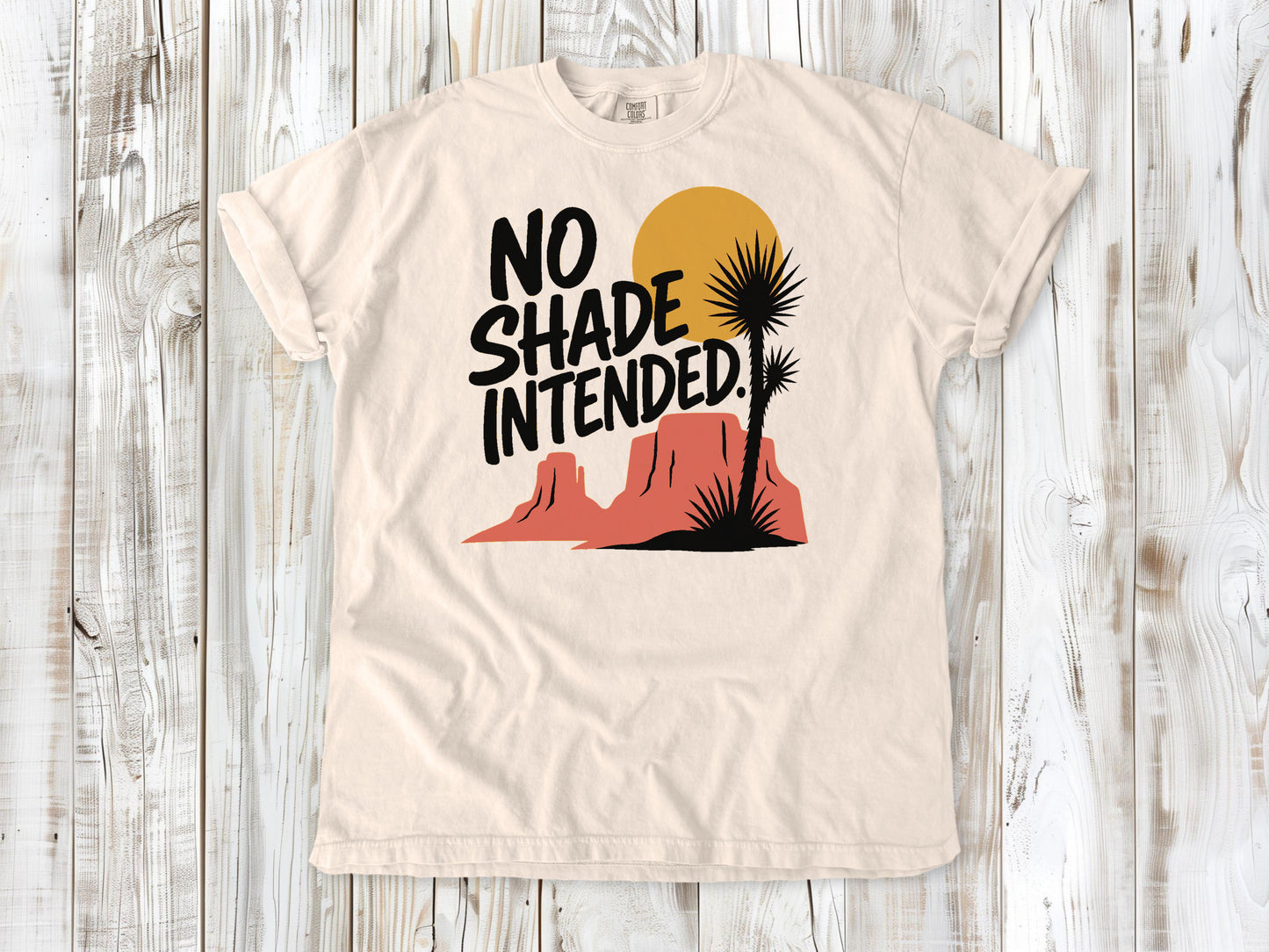 Butter garment-dyed tee with No Shade Intended desert hiking graphic.