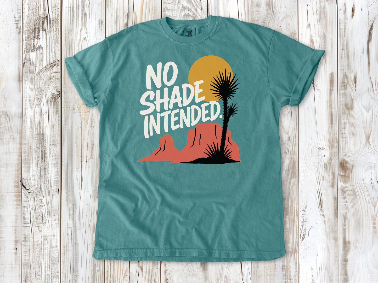 Mustard garment-dyed tee with No Shade Intended desert hiking graphic.