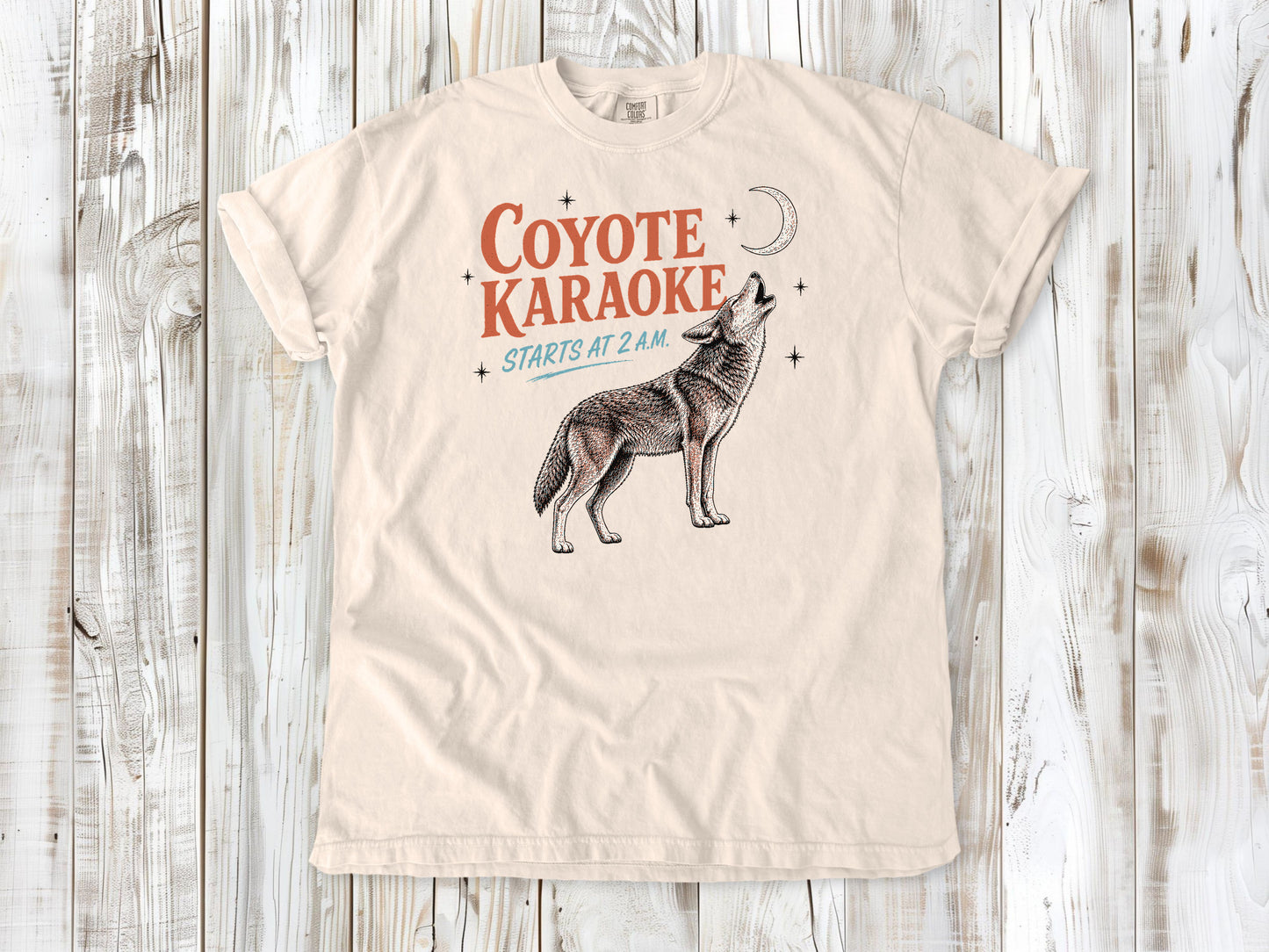 Butter garment-dyed tee with Coyote Karaoke Starts at 2 AM camping graphic.