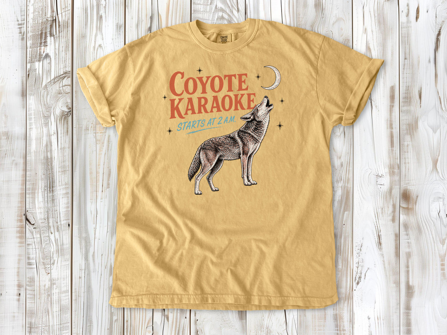 Burnt Orange garment-dyed tee with Coyote Karaoke Starts at 2 AM camping graphic.