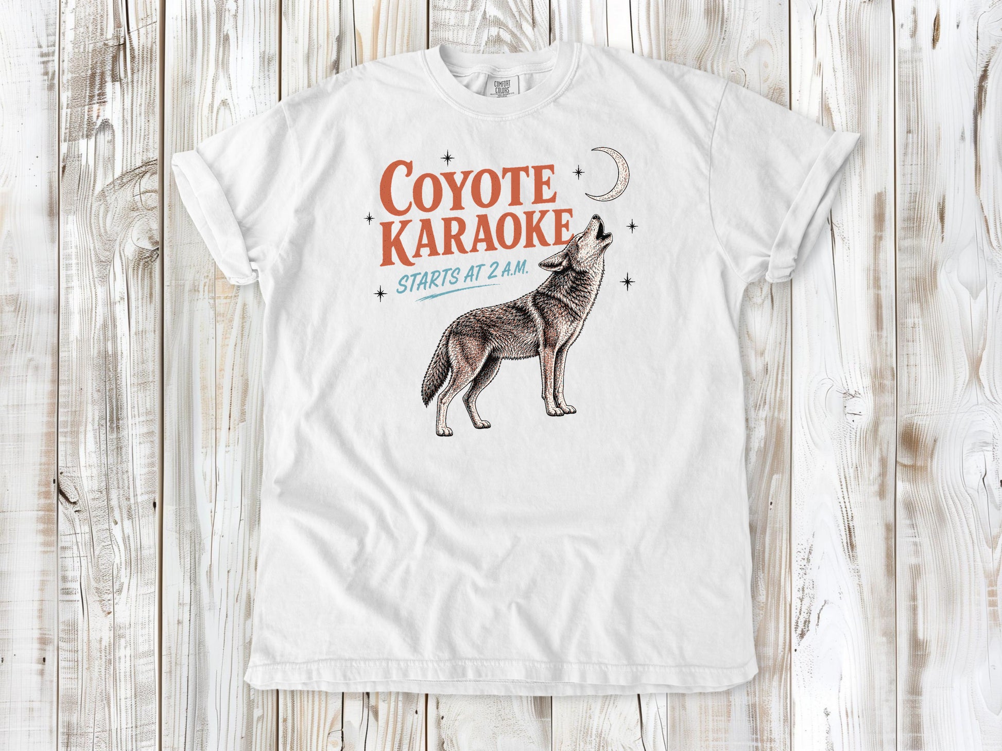 White garment-dyed tee with Coyote Karaoke Starts at 2 AM camping graphic.