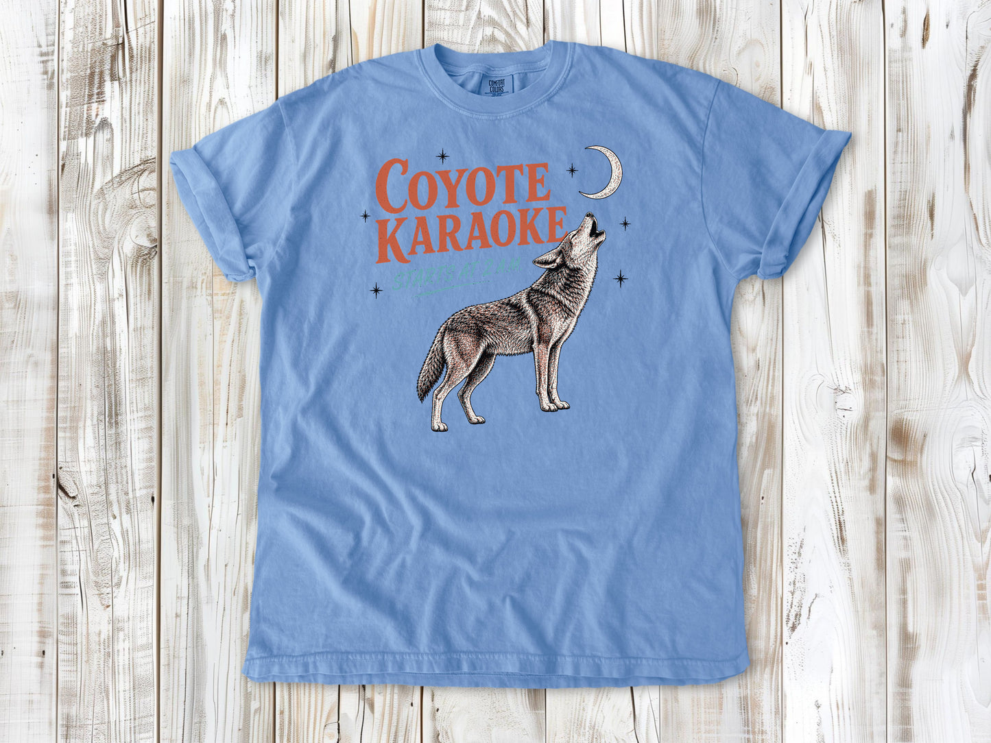 Pepper garment-dyed tee with Coyote Karaoke Starts at 2 AM camping graphic.