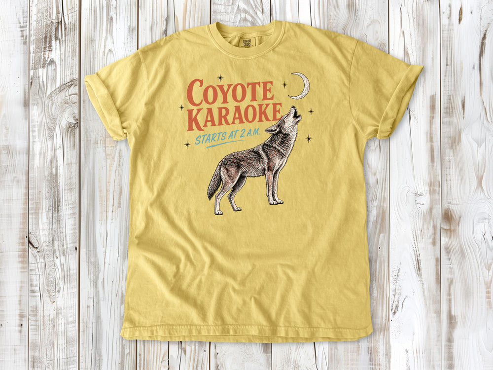 Grey garment-dyed tee with Coyote Karaoke Starts at 2 AM camping graphic.