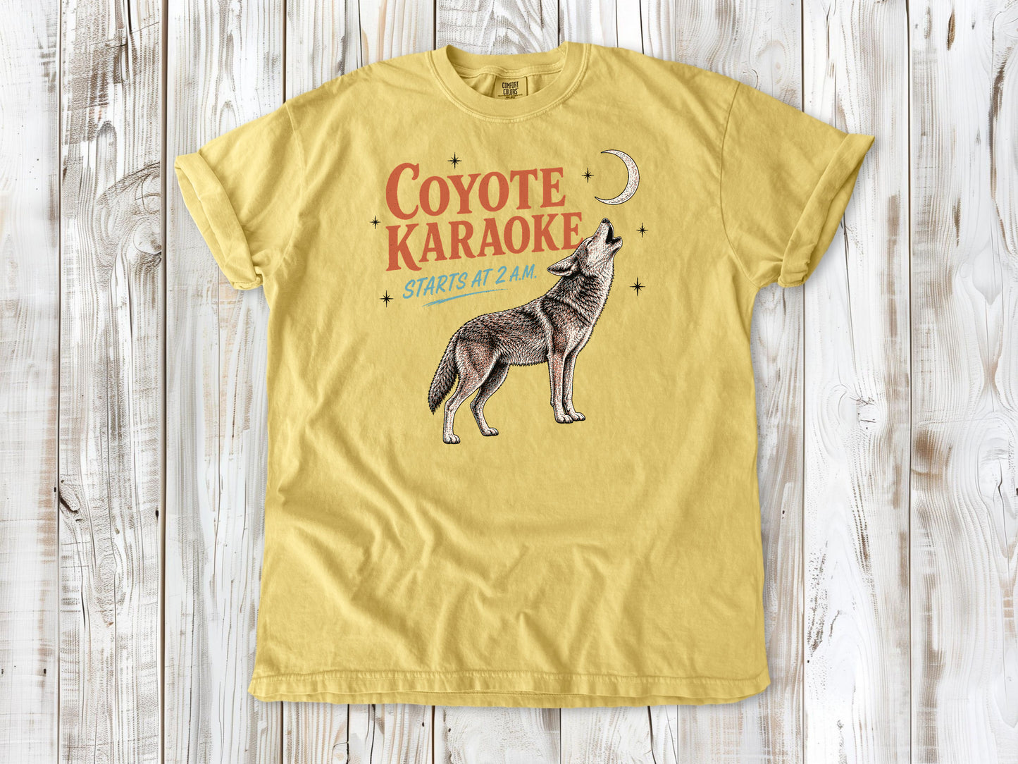Grey garment-dyed tee with Coyote Karaoke Starts at 2 AM camping graphic.