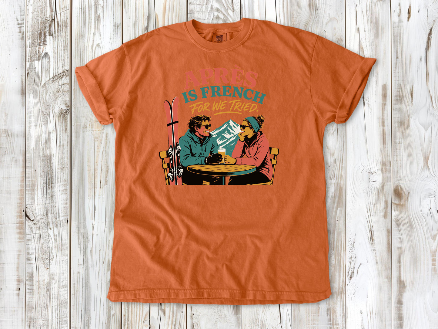Seafoam garment-dyed tee with Après Is French for We Tried skiing graphic.