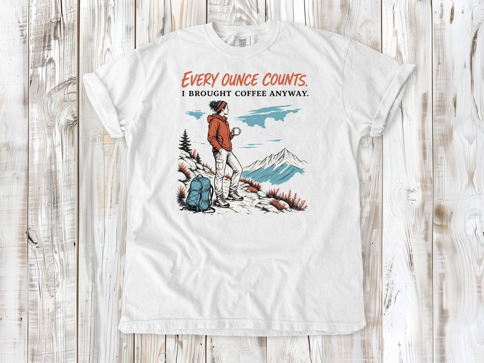 White garment-dyed tee with Every Ounce Counts I Brought Coffee Anyway backpacking graphic.