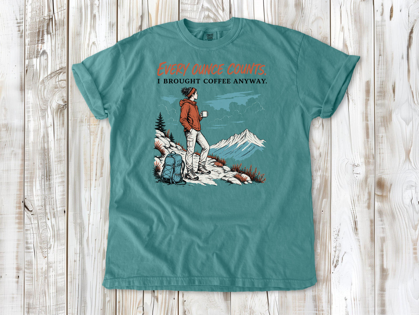 Mustard garment-dyed tee with Every Ounce Counts I Brought Coffee Anyway backpacking graphic.
