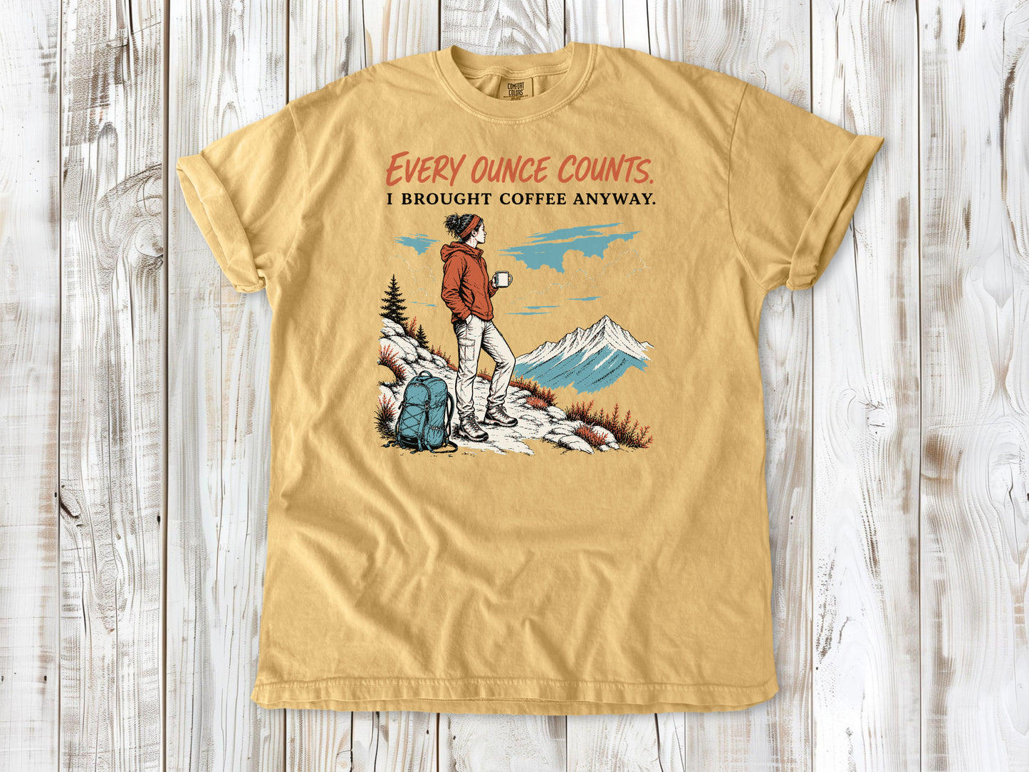 Burnt Orange garment-dyed tee with Every Ounce Counts I Brought Coffee Anyway backpacking graphic.