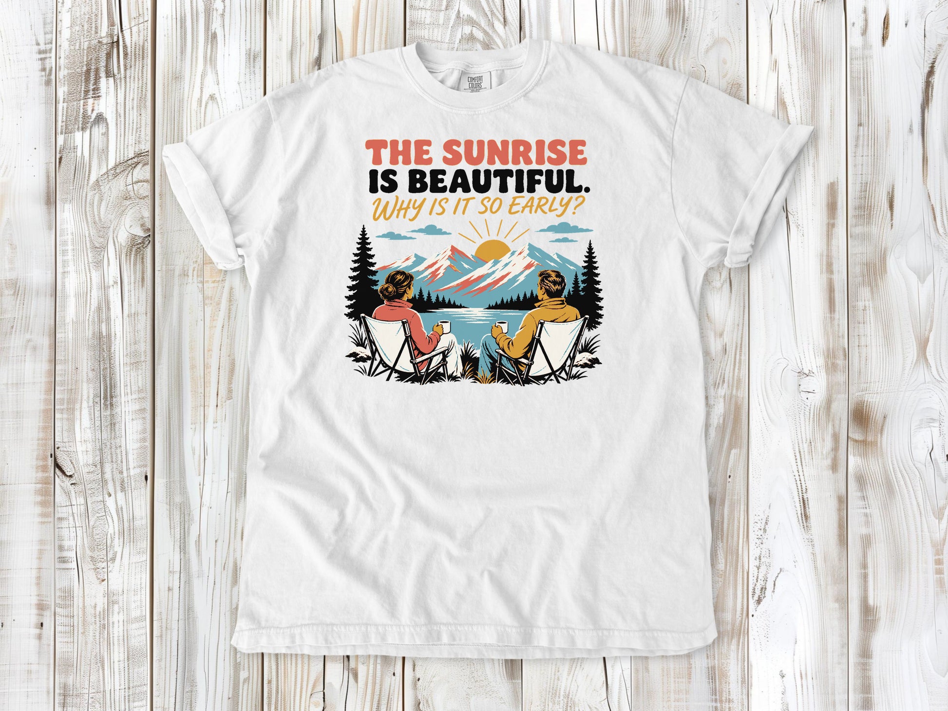 White garment-dyed tee with The Sunrise Is Beautiful Why Is It So Early outdoor graphic.