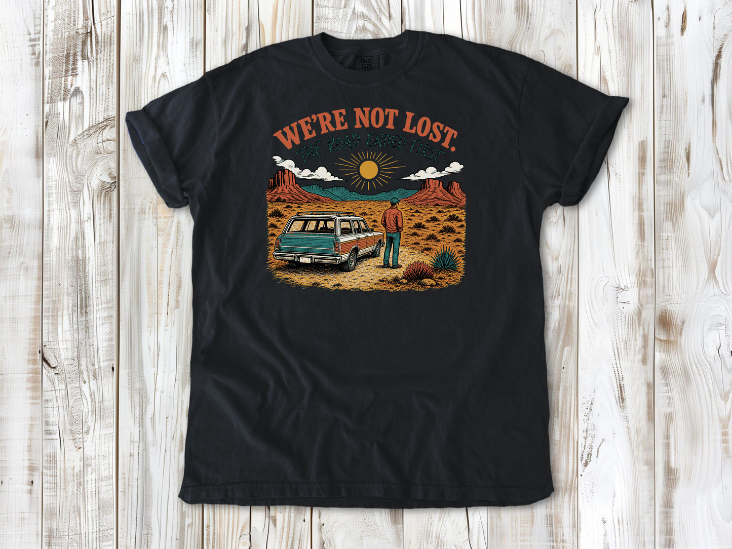 Washed Denim garment-dyed tee with We're Not Lost The Road Ended First off-road graphic.