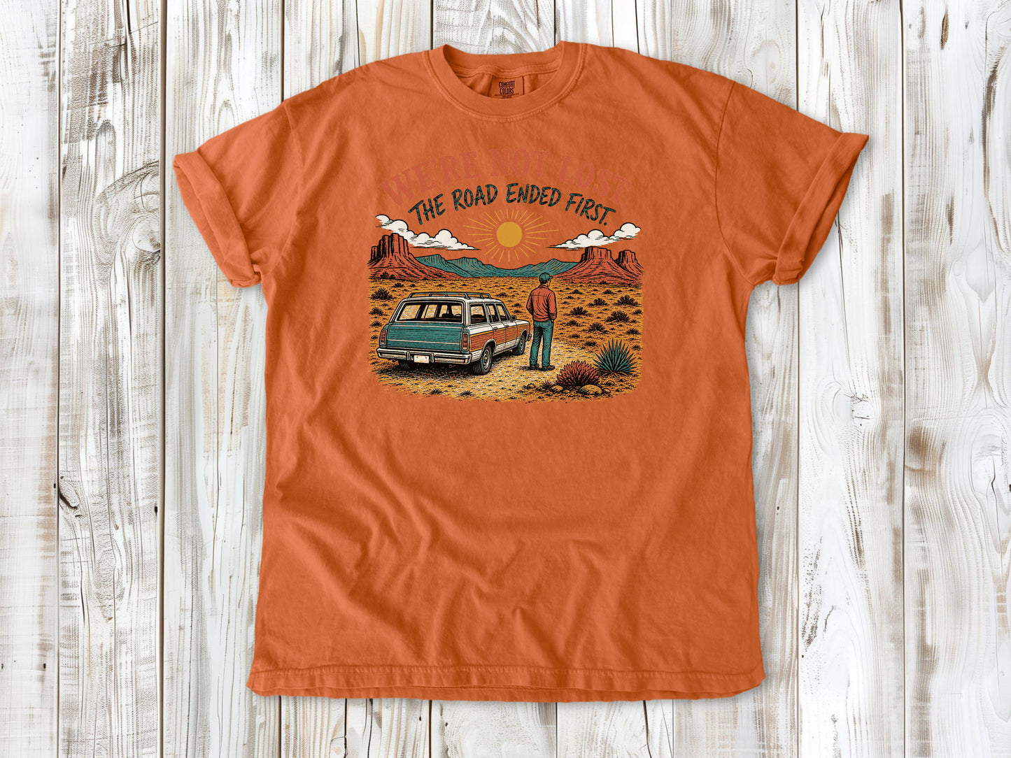 Seafoam garment-dyed tee with We're Not Lost The Road Ended First off-road graphic.