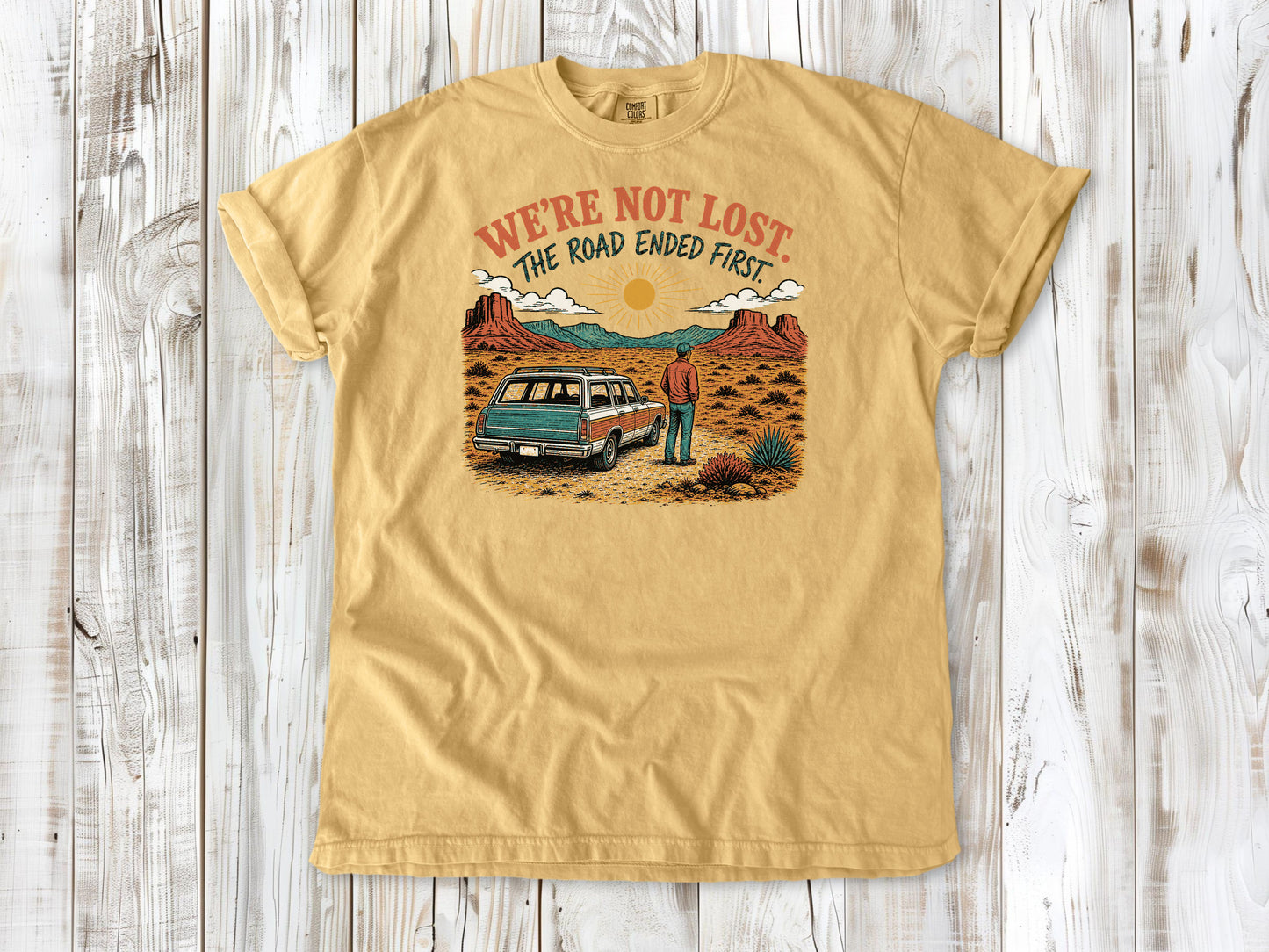 Burnt Orange garment-dyed tee with We're Not Lost The Road Ended First off-road graphic.