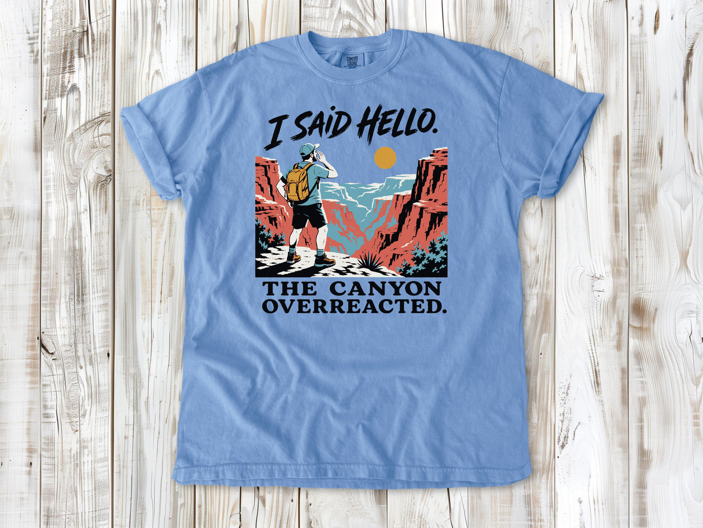 Pepper garment-dyed tee with I Said Hello The Canyon Overreacted hiking graphic.