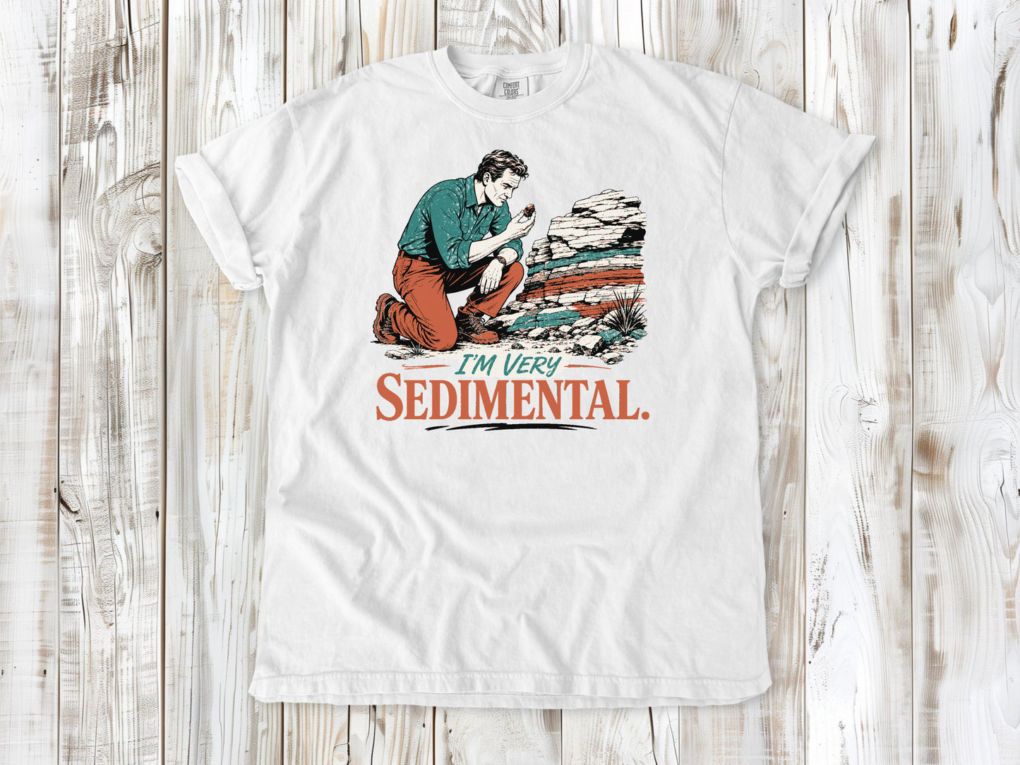 White garment-dyed tee with I'm Very Sedimental rockhound graphic.