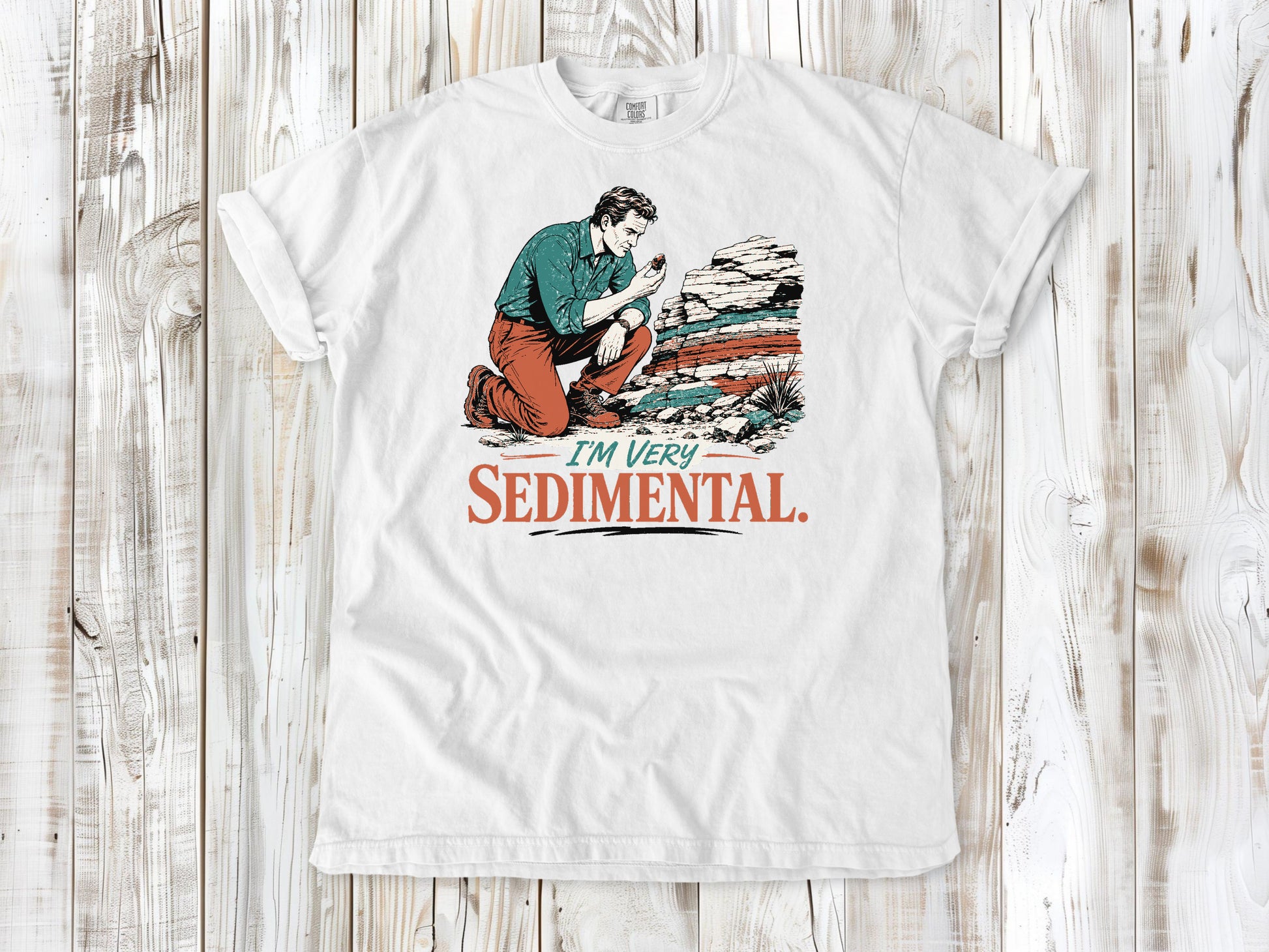 White garment-dyed tee with I'm Very Sedimental rockhound graphic.