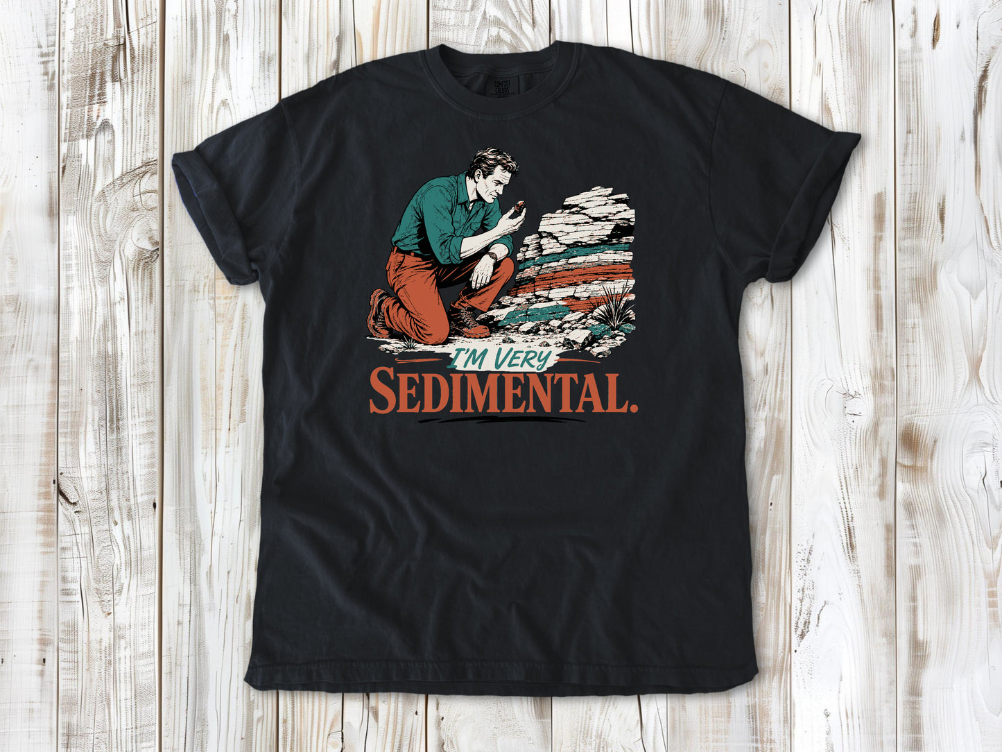 Washed Denim garment-dyed tee with I'm Very Sedimental rockhound graphic.
