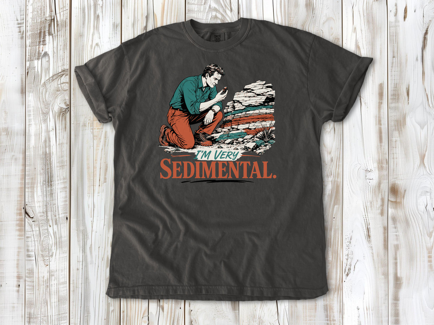 Ivory garment-dyed tee with I'm Very Sedimental rockhound graphic.