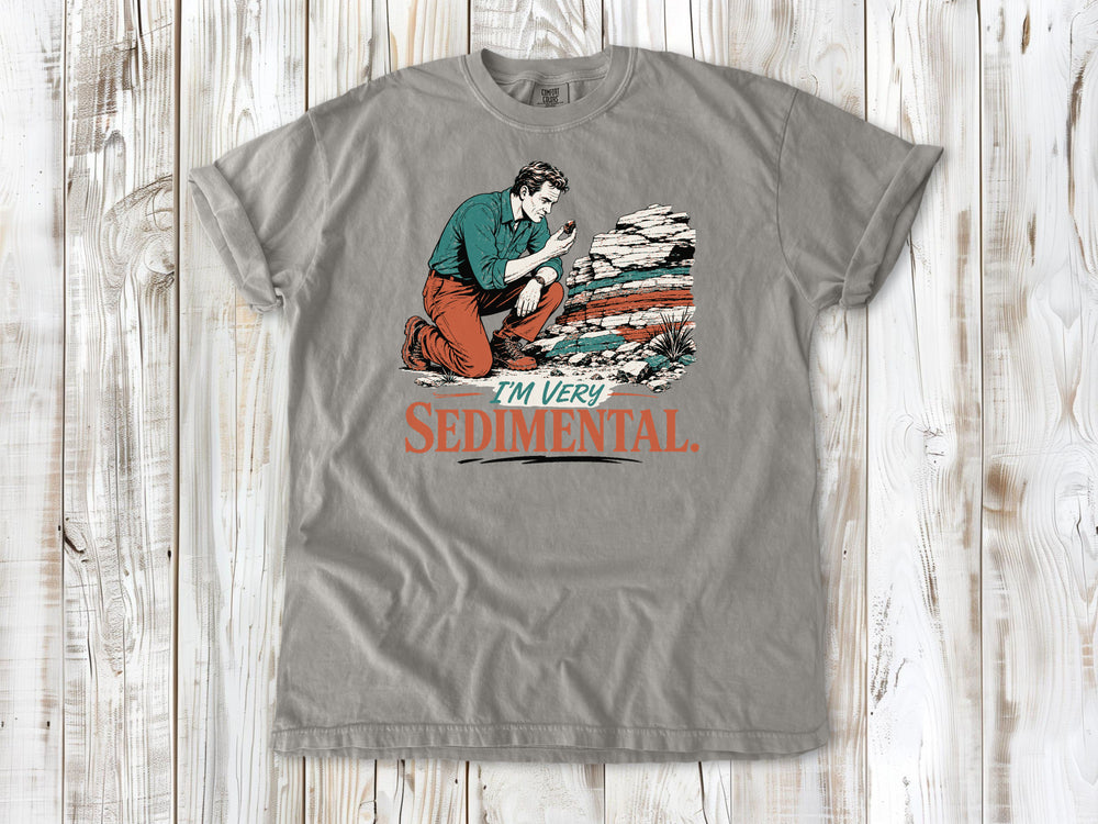 Khaki garment-dyed tee with I'm Very Sedimental rockhound graphic.