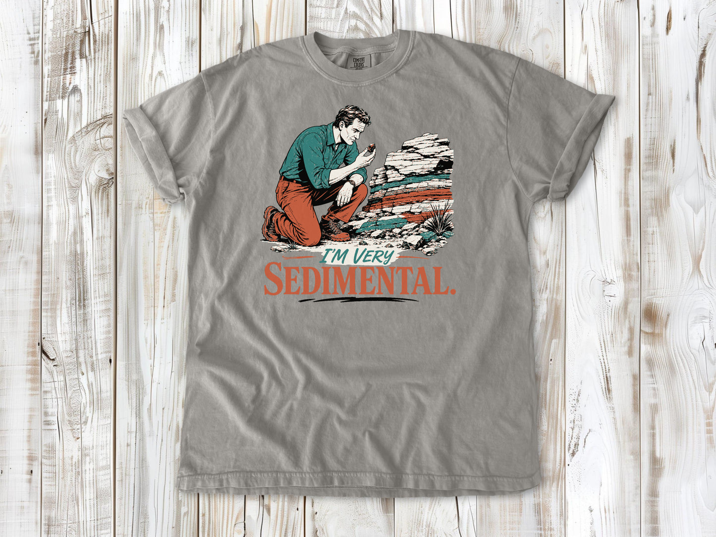 Khaki garment-dyed tee with I'm Very Sedimental rockhound graphic.