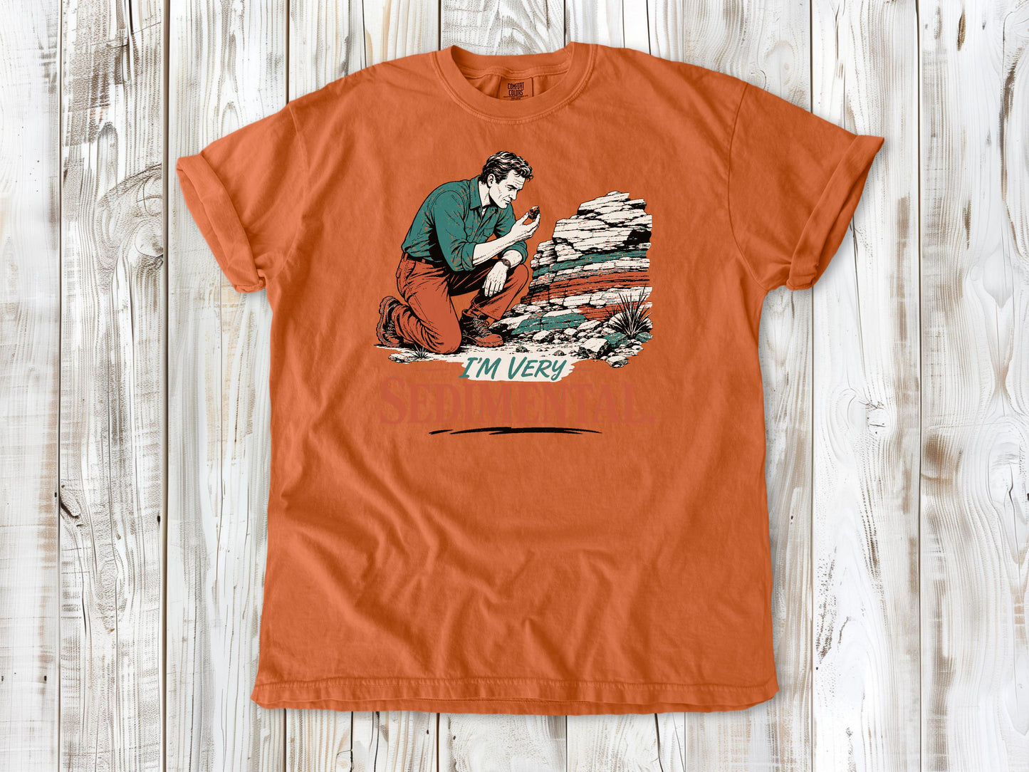 Seafoam garment-dyed tee with I'm Very Sedimental rockhound graphic.