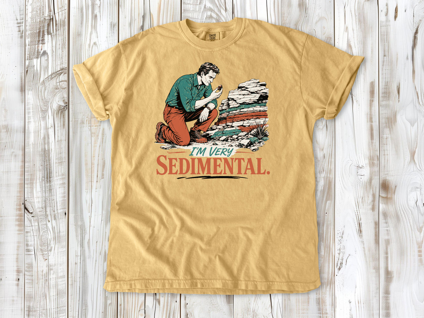 Burnt Orange garment-dyed tee with I'm Very Sedimental rockhound graphic.