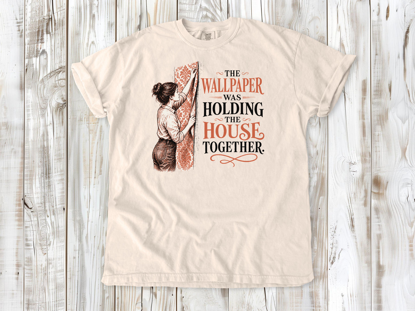 Butter garment-dyed tee with The Wallpaper Was Holding the House Together renovation graphic.