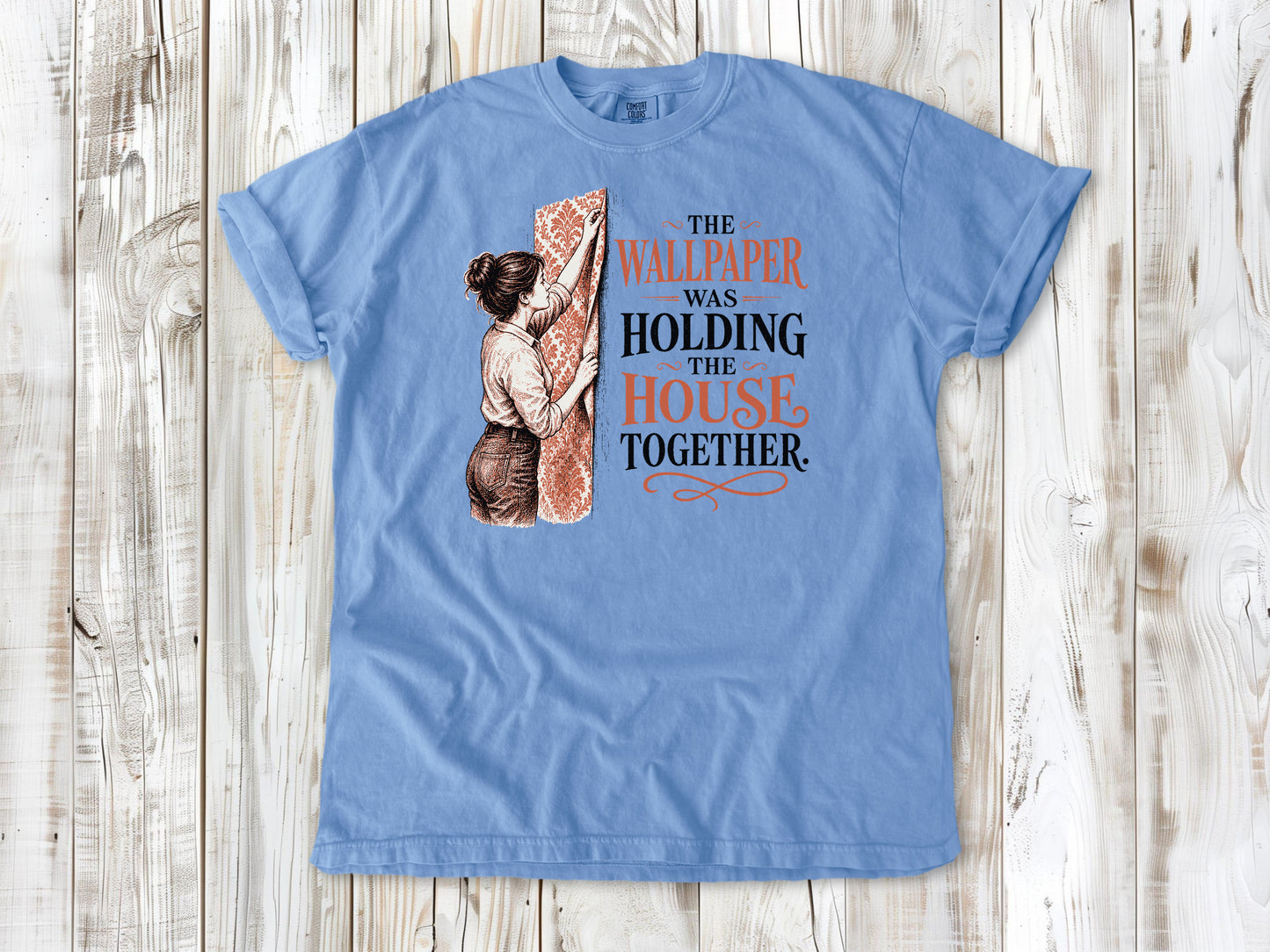 Pepper garment-dyed tee with The Wallpaper Was Holding the House Together renovation graphic.