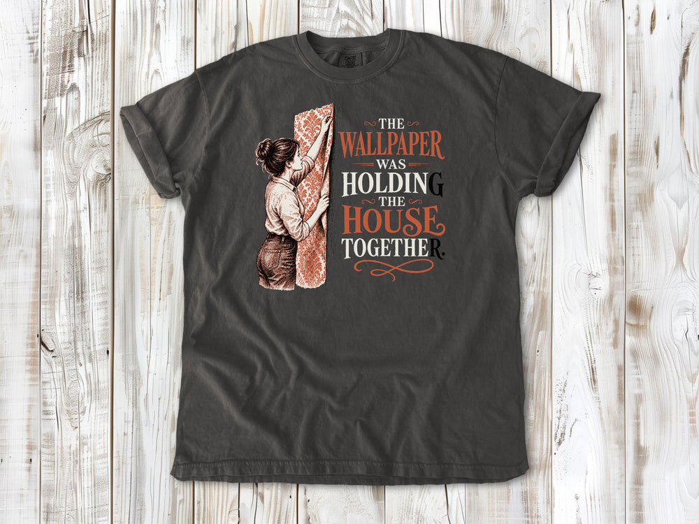 Ivory garment-dyed tee with The Wallpaper Was Holding the House Together renovation graphic.