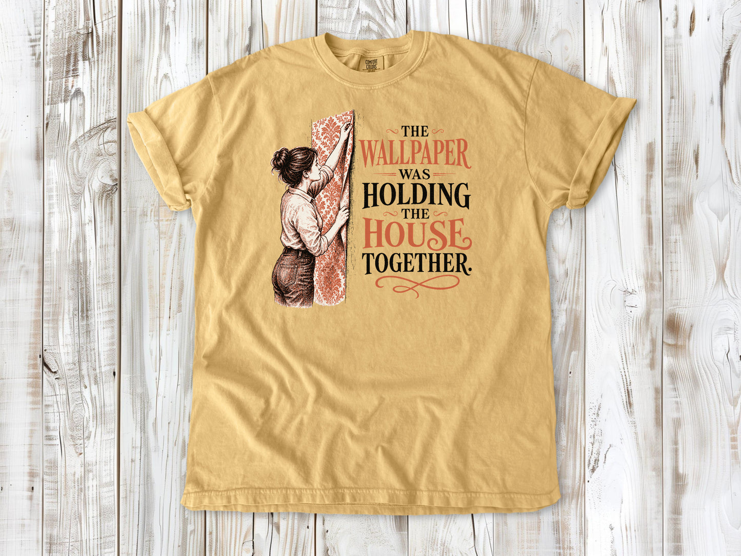 Burnt Orange garment-dyed tee with The Wallpaper Was Holding the House Together renovation graphic.