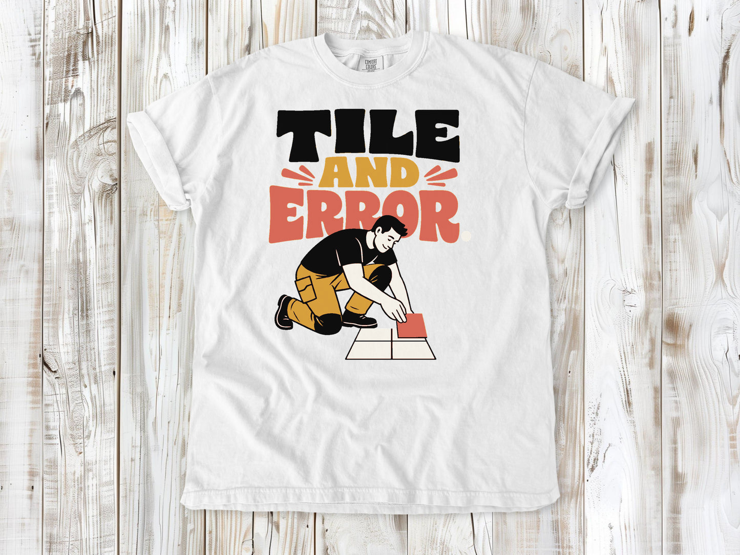 White garment-dyed tee with Tile and Error tile setter graphic.
