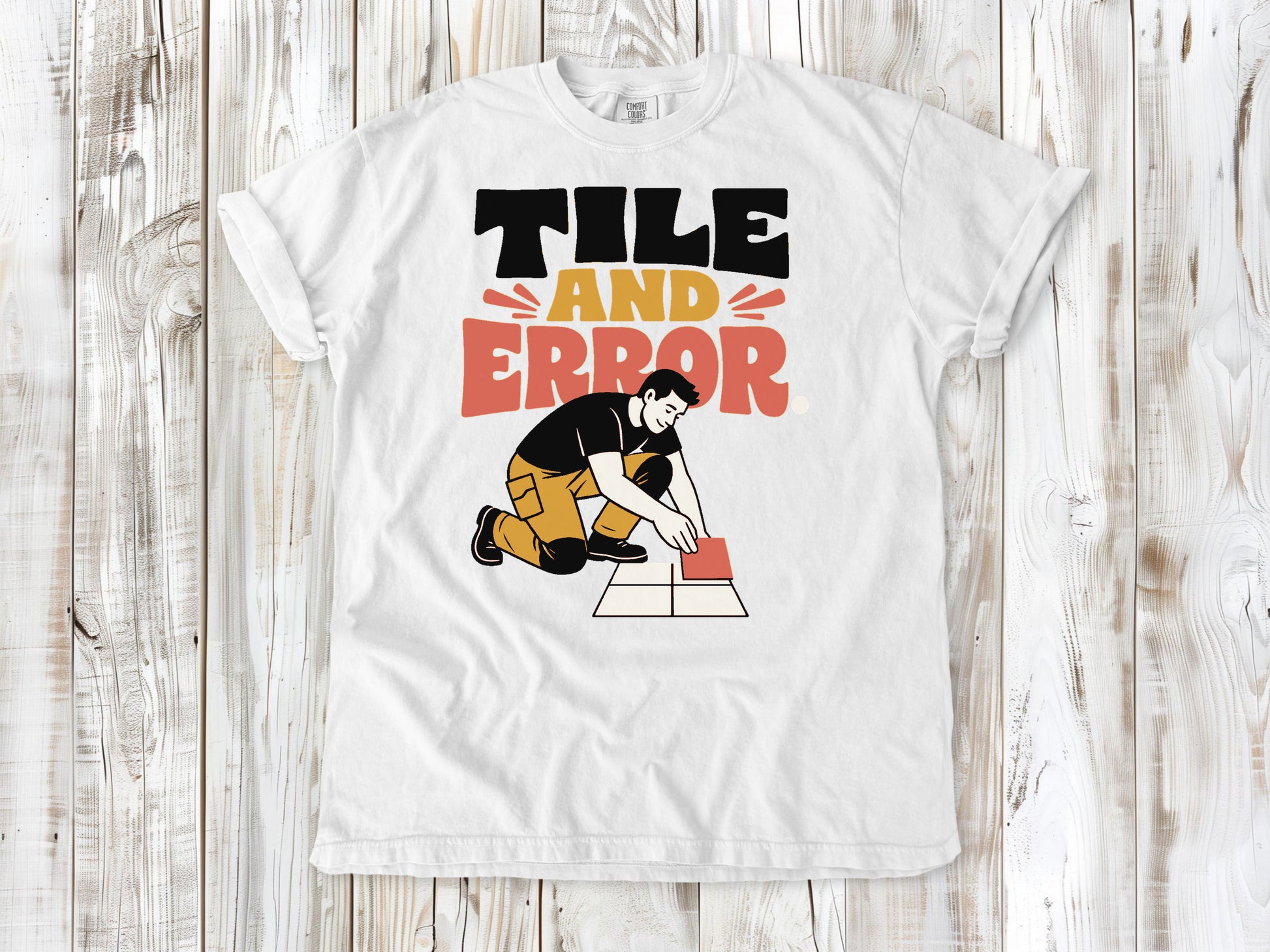 White garment-dyed tee with Tile and Error tile setter graphic.
